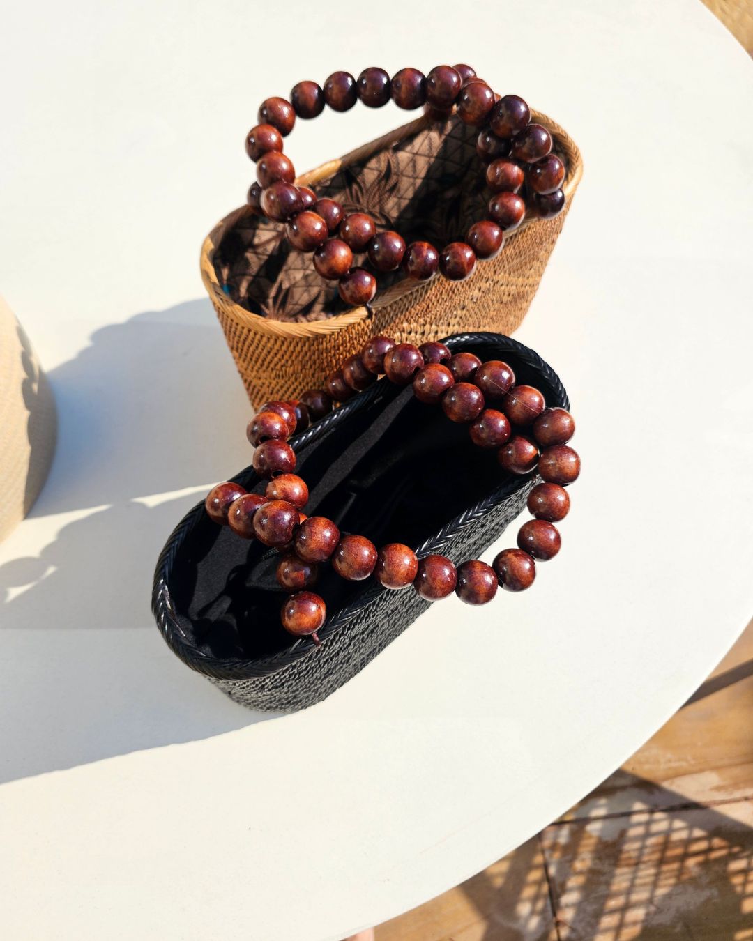 https://oh-sun.com/wp-content/uploads/2025/05/Lucia-Rattan-And-Wooden-Bead-Tote-Black-Chestnut.jpg