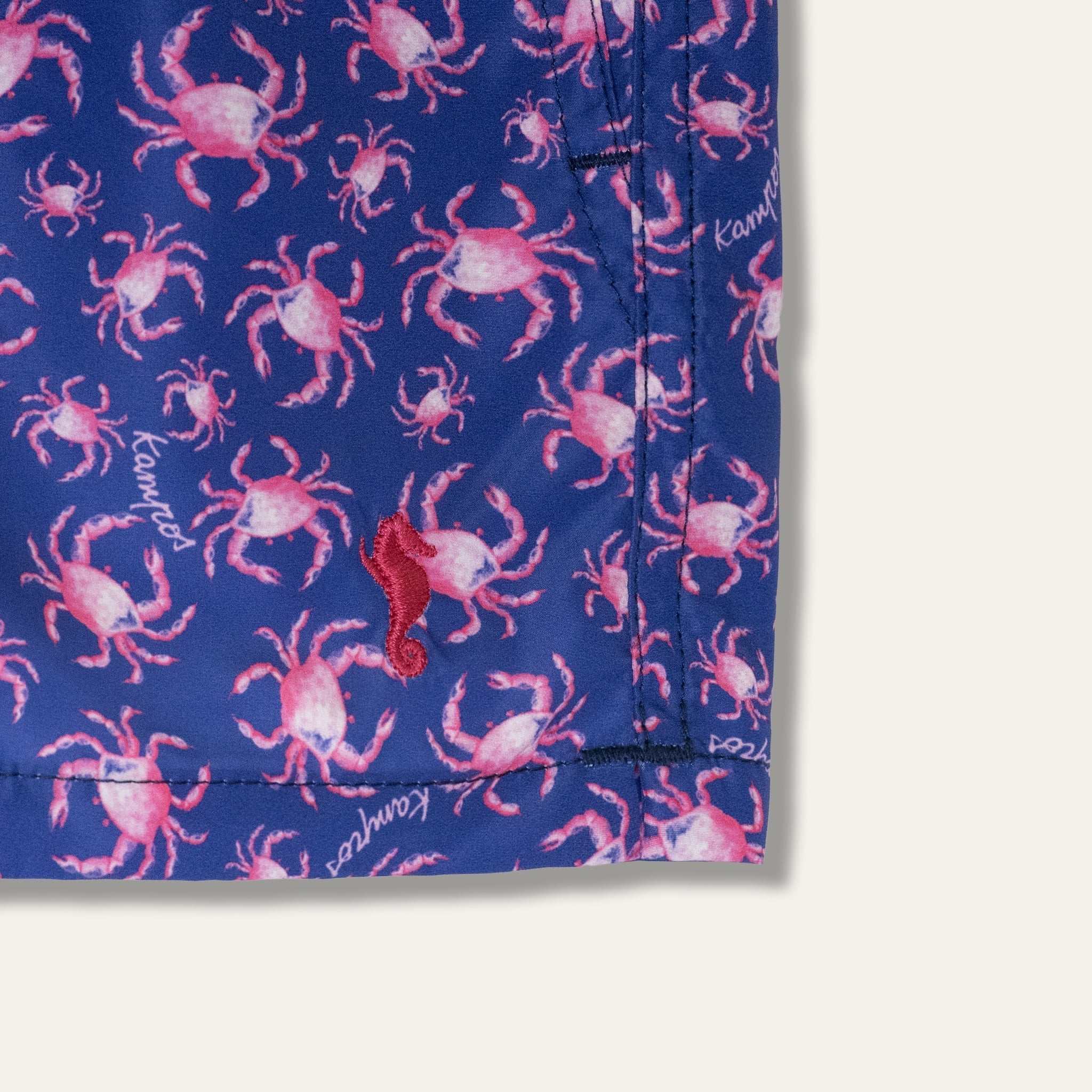 https://cdn.shopify.com/s/files/1/0853/1227/4697/files/k-a-m-p-o-s-swim-shorts-craby-pink-kids-688317.jpg?v=1741948110