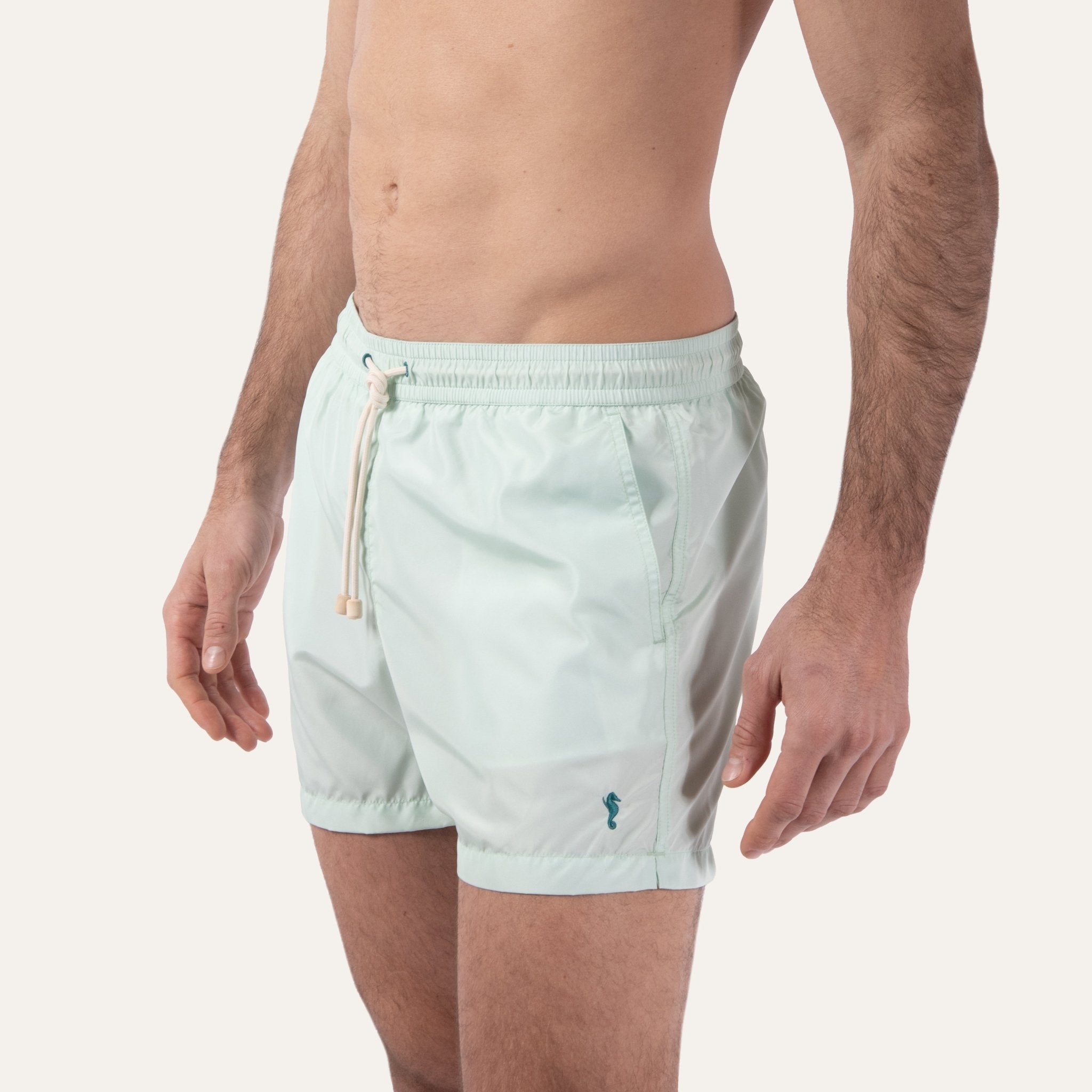 https://cdn.shopify.com/s/files/1/0853/1227/4697/files/k-a-m-p-o-s-swim-shorts-sage-548216.jpg?v=1741947329