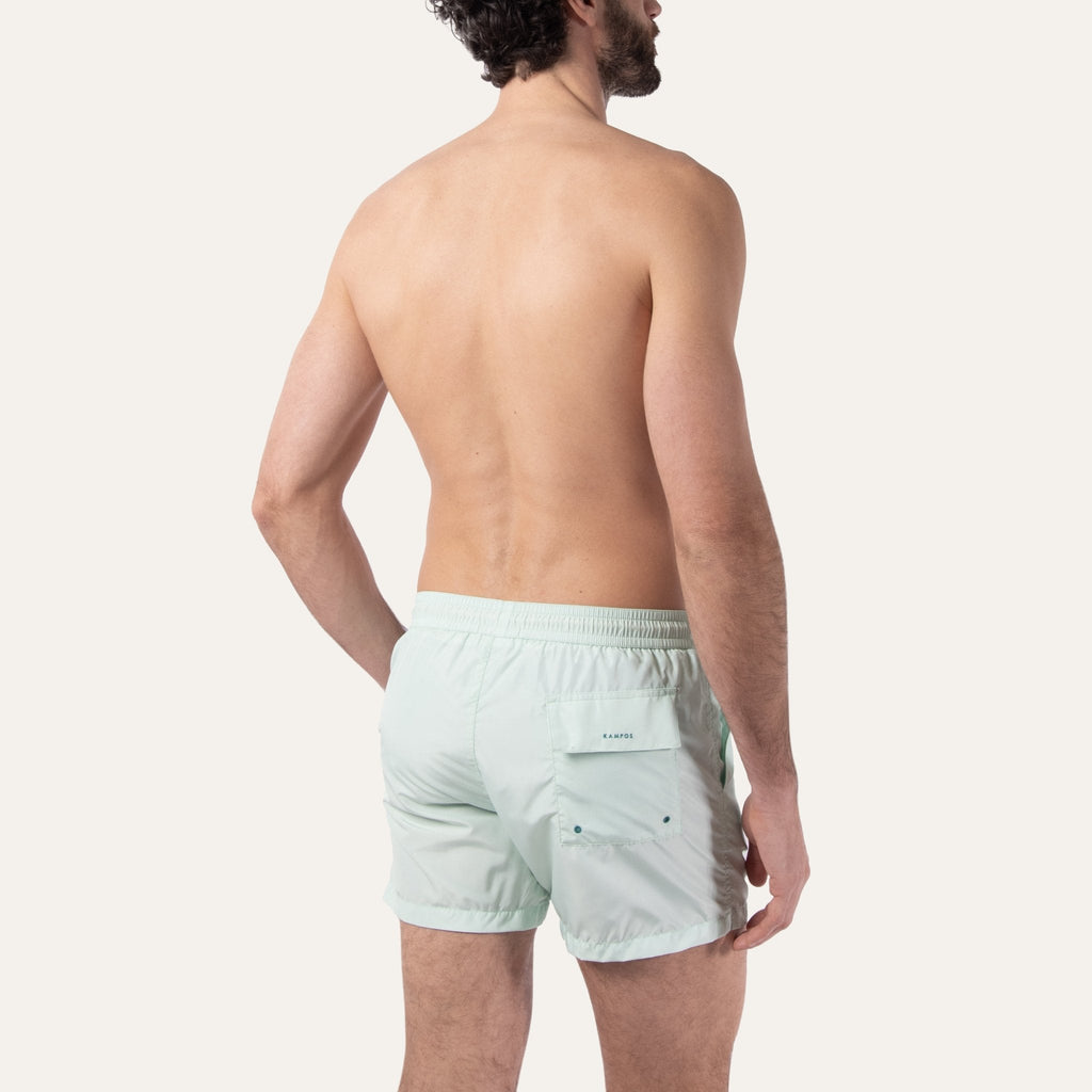 https://cdn.shopify.com/s/files/1/0853/1227/4697/files/k-a-m-p-o-s-swim-shorts-sage-746991.jpg?v=1741947329