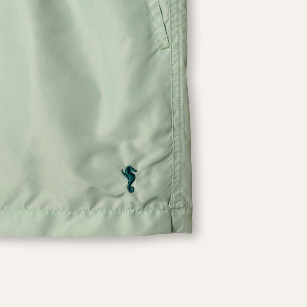 https://cdn.shopify.com/s/files/1/0853/1227/4697/files/k-a-m-p-o-s-swim-shorts-sage-755964.jpg?v=1741947329