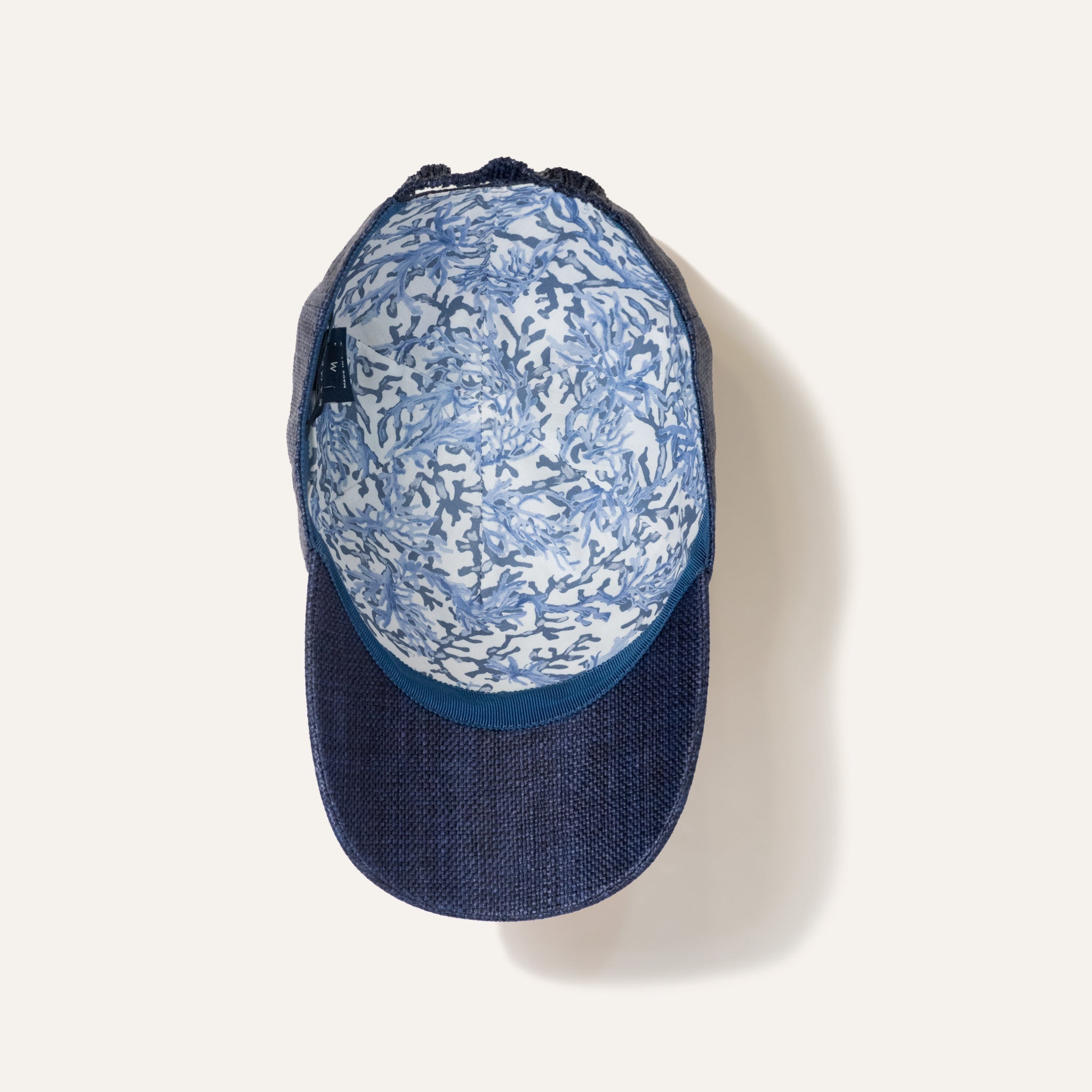 https://cdn.shopify.com/s/files/1/0853/1227/4697/files/kampos-baseball-hat-rafia-navy-584352_5a24f30b-e962-43cb-a0eb-7692482de851.jpg?v=1741947654