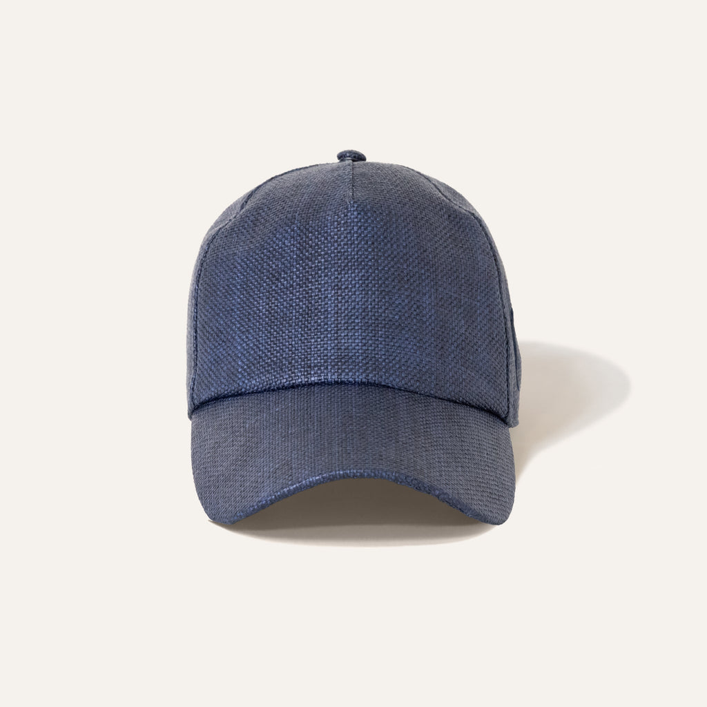 https://cdn.shopify.com/s/files/1/0853/1227/4697/files/kampos-baseball-hat-rafia-navy-715028_83786fe9-ba2f-4b81-bd19-be19e6d5a36a.jpg?v=1741947654