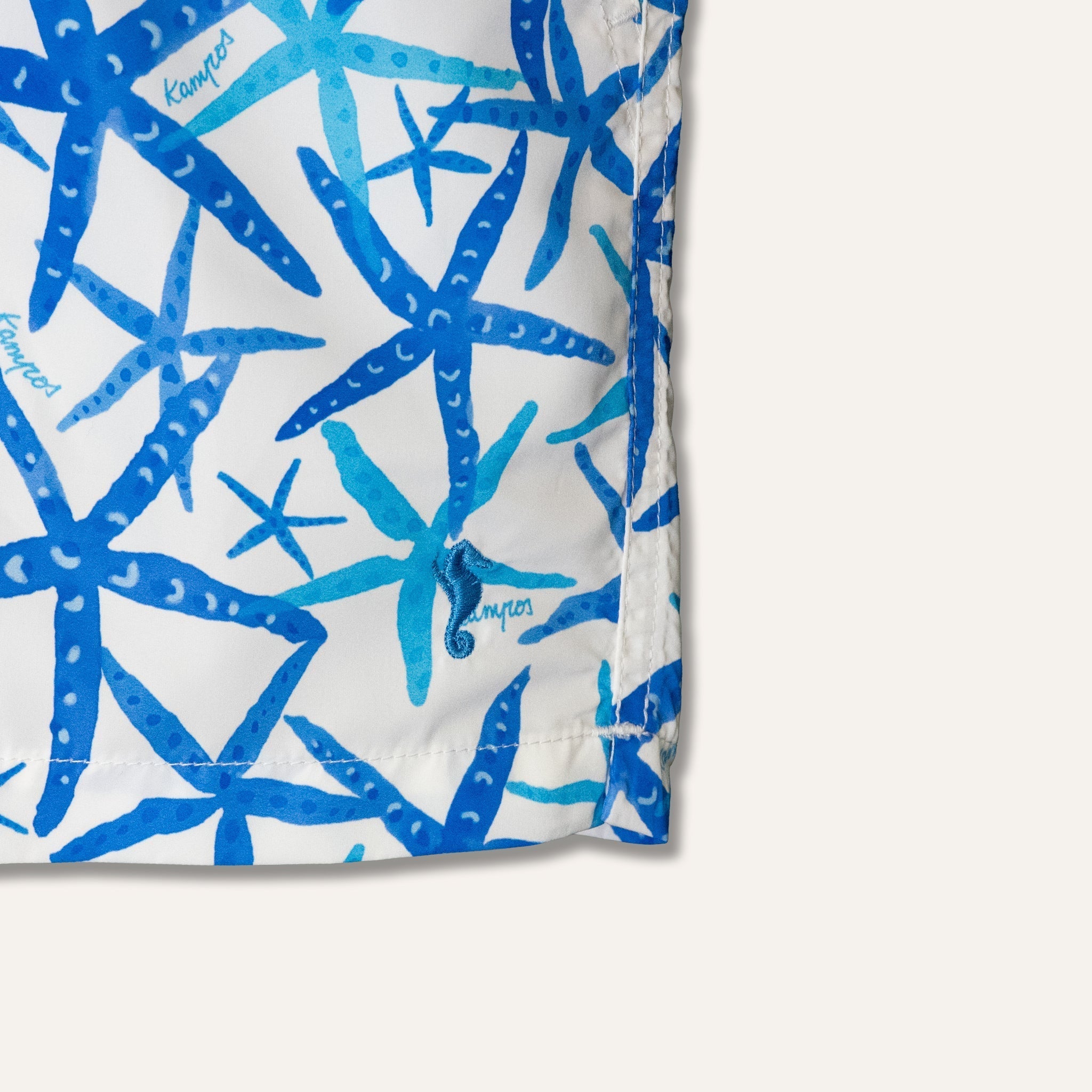 https://cdn.shopify.com/s/files/1/0853/1227/4697/files/kampos-swim-shorts-long-starfish-white-170096_610fe673-4f09-466b-9aec-1d89128536dd.jpg?v=1758013860