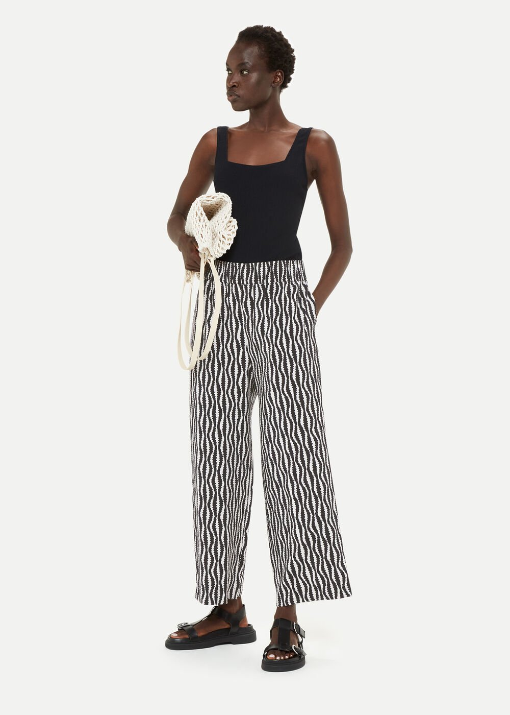 https://www.whistles.com/dw/image/v2/BDCH_PRD/on/demandware.static/-/Sites-whistles-master-catalog/default/dw8344b015/images/00803713000/whistles-optical-rope-cropped-trouser-black-white-05.jpg?sw=1000&sh=1400&strip=false